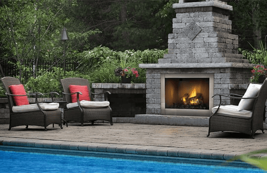 Cozy outdoor fireplace with seating on a beautifully landscaped patio for comfort and relaxation.